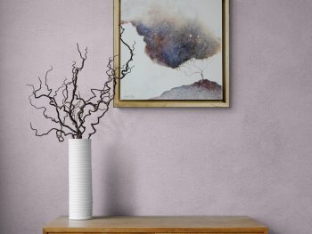 Atmospheric landscape painting with golden trees and dark storm sky by Australian artist Lucinda Leveille