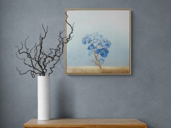 Atmospheric landscape painting with golden trees and dark storm sky by Australian artist Lucinda Leveille