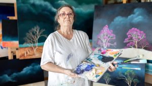 portrait of Lucinda Leveille in painting clothes in her studio