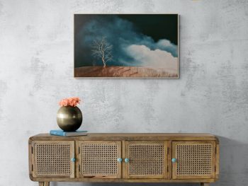 Original Australian atmospheric landscape oil painting featuring a dramatic sky with soft light breaking through layered clouds and featuring gum trees