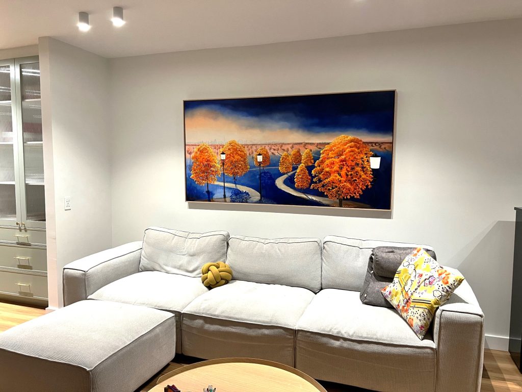 Commissioned atmospheric landscape painting by Lucinda Leveille installed in a contemporary Canberra interior inspired by memories of Primrose Hill London, featuring dramatic skies and glowing autumn tree
