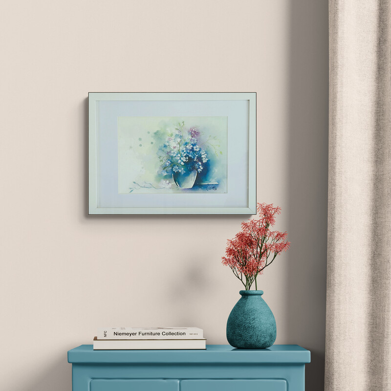 Blue calm watercolour on paper featuring a soft blue and white floral arrangement, presented in a simple ready to hang frame by Lucinda Leveille